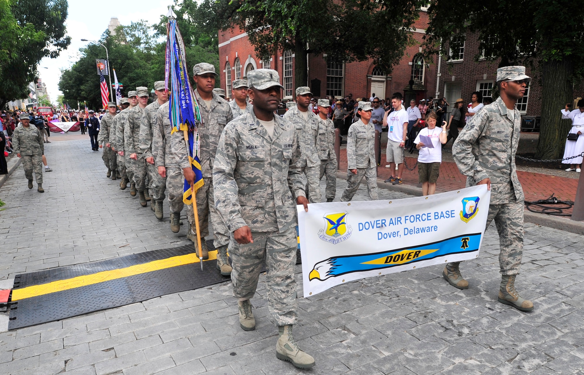 Team Dover members march in the WAWA Welcome America Independence Day Parade July 4, 2013, in Philadelphia, Pa. More than 30 Dover Air Force Base Airmen and the Dover AFB Honor Guard marched in the parade. (U.S. Air Force photo/Tech. Sgt. Chuck Walker)