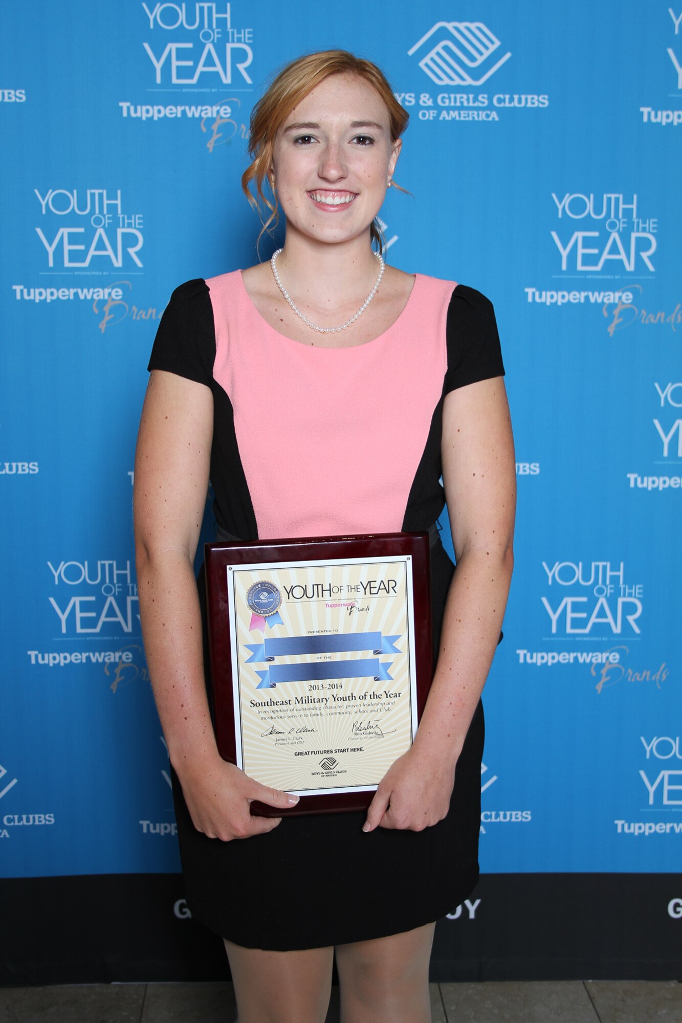 Stephanie Ramer poses for a photo holding a plaque after being named the – Boys & Girls Clubs of America (BGCA) 2013 to 2014 Southeast Military Youth of the Year. Ramer graduated high school in 2013 with a 4.43 GPA and was accepted to Pennsylvania State Unniversity Honors College. (Courtesy photo)
