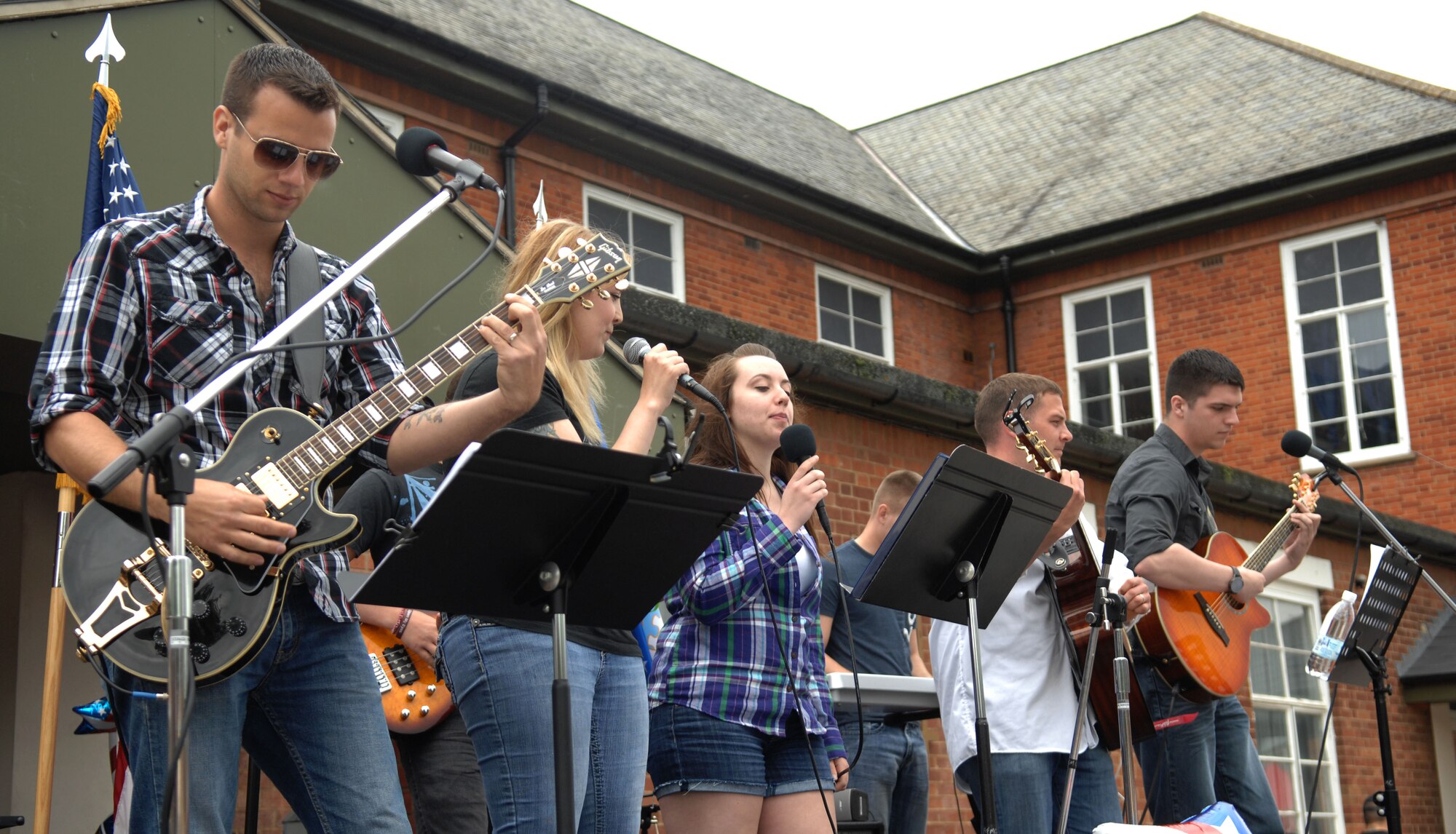 The Chapel Band performs songs for Team Mildenhall members July 3, 2013, during the Independence Day celebration on RAF Mildenhall, England. The Chapel Band, along with other musical and spoken-word acts, performed throughout the celebration of life, liberty and the pursuit of happiness. (U.S. Air Force photo by Airman 1st Class Dillon Johnston/Released)