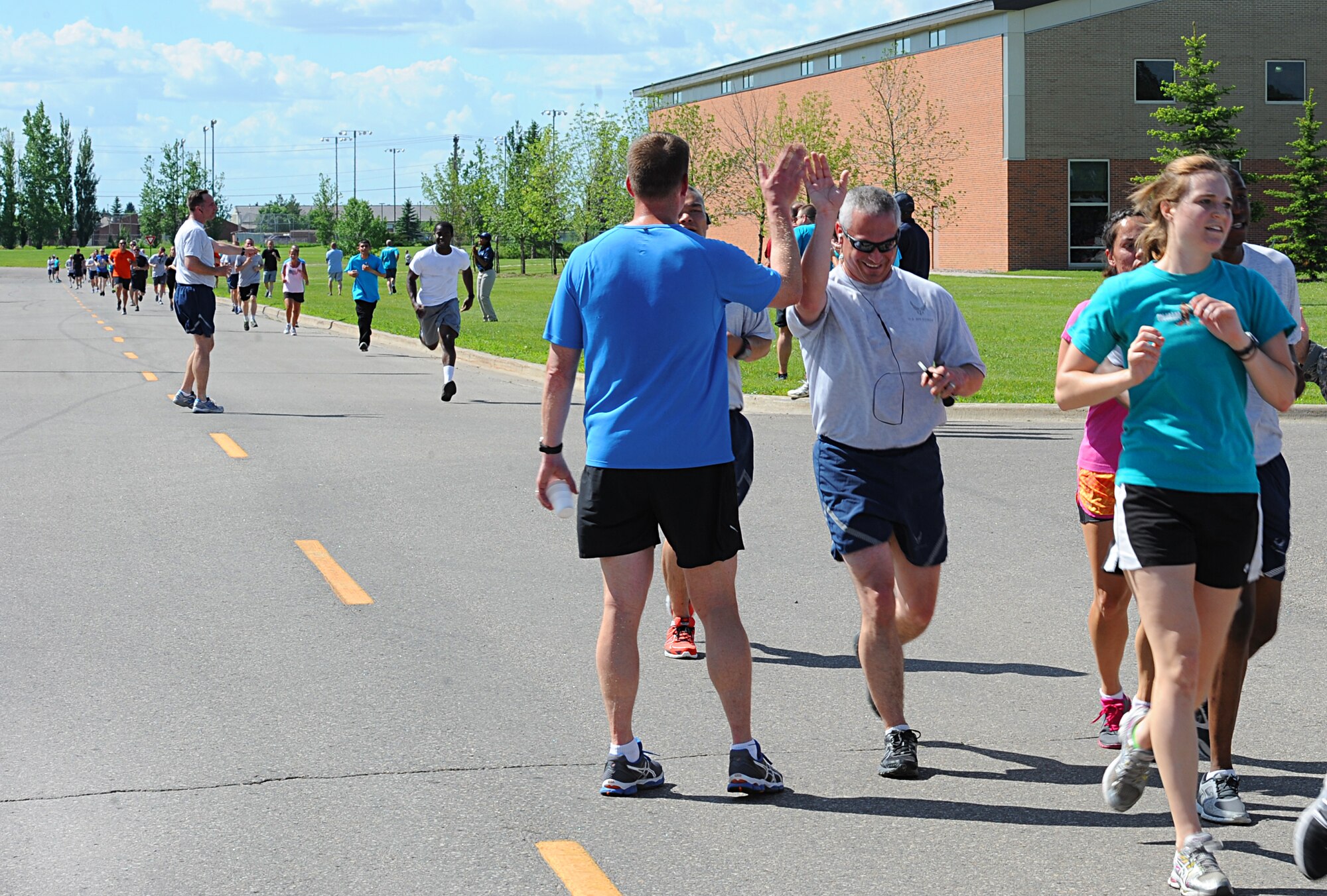 As part of the Sexual Assault Prevention stand-down day, Airmen from Minot Air Force Base showed up by the hundreds to support a 5K run here, June 28, 2013. Airmen also participated in group talks and listened to base leadership as they addressed the masses via two all calls, where they called upon everyone to stand together and stop this growing problem. (U.S. Air Force photo/Staff Sgt. Keith Ballard)
