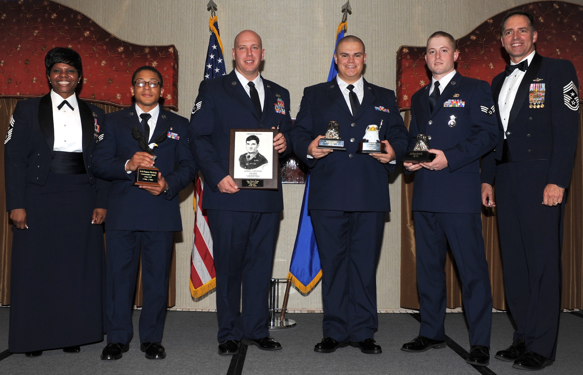 The Airman Leadership School Class 13-F graduated during a ceremony held at Minot Air Force Base’s Jimmy Doolittle Center here, June 27. Congratulations to the graduates and special recognition to the following award winners: Commandant's Award: Senior Airman Dequan Nicholas, 5th Medical Support Squadron; Academic Achievement Award and Distinguished Graduate: Senior Airman Samuel Bell, 91st Missile Maintenance Squadron; Distinguished Graduate Award: Senior Airman Bryan Bartruff, 5th Security Forces Squadron; John L. Levitow Award: Staff Sgt. Travis Kane, 219th Security Forces Squadron. Congratulations ALS Class 13-F! (U.S. Air Force photo/Airman 1st Class Stephanie Ashley)