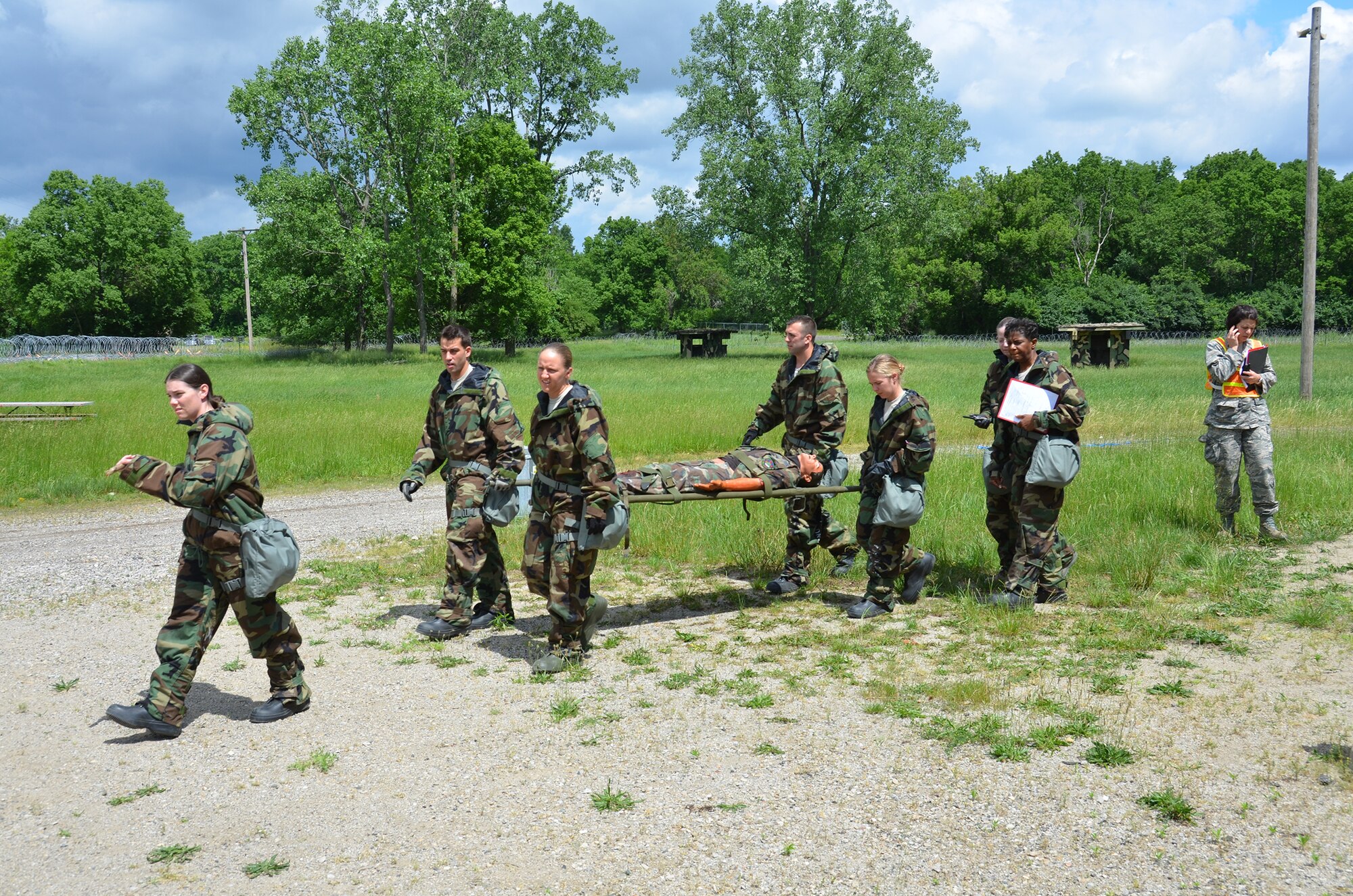 WRIGHT-PATTERSON AIR FORCE BASE, Ohio – Reservists assigned to the 445th Aeromedical Staging Squadron practice transporting a patient in a simulated deployed location during the June 2 unit training assembly. (U.S. Air Force photo/Master Sgt. Charlie Miller)