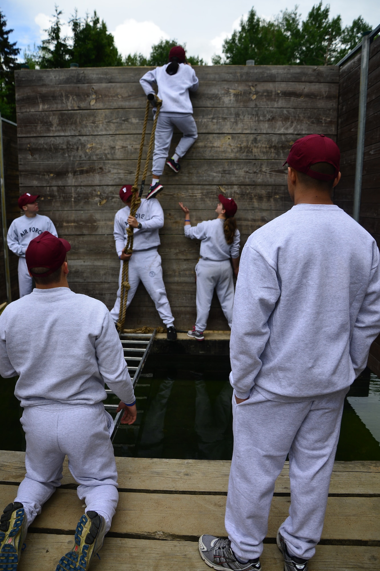 A group of Air Force Junior Reserve Officers’ Training Corps cadets negotiate an obstacle at the leadership reaction course June 24, 2013, Grafenwoehr, Germany. The leadership reaction course gave the students an opportunity to test their teamwork and leadership ability. According to its website, the JROTC objectives are to educate and train high school cadets in citizenship, promote community service, instill responsibility, character, and self-discipline, and provide instruction in air and space fundamentals. (U.S. Air Force photo/Tech. Sgt. Chad Thompson)