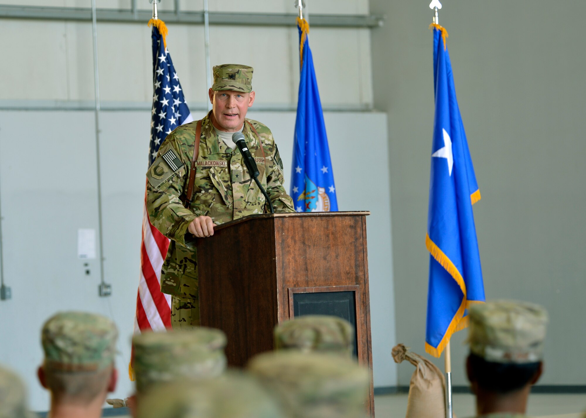 Brig. Gen. Patrick C. Malackowski, 455th Air Expeditionary Wing commander, addresses 455th AEW service members during a change of command ceremony at Bagram Airfield, Afghanistan, July 8. (U.S. Air Force photo/Staff Sgt. Stephenie Wade)