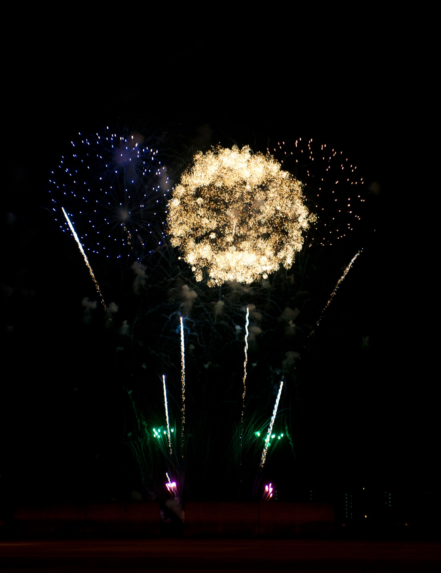 YOKOTA AIR BASE, Japan -- Fireworks explode over Yokota Air Base, Japan, during the annual Celebrate America, July 4, 2013. The installation hosted a number of events during the day the cumulated in a performance by the Lt. Dan Band and a fireworks display. (U.S. Air Force photo by Airman 1st Class photo by Meagan Schutter))