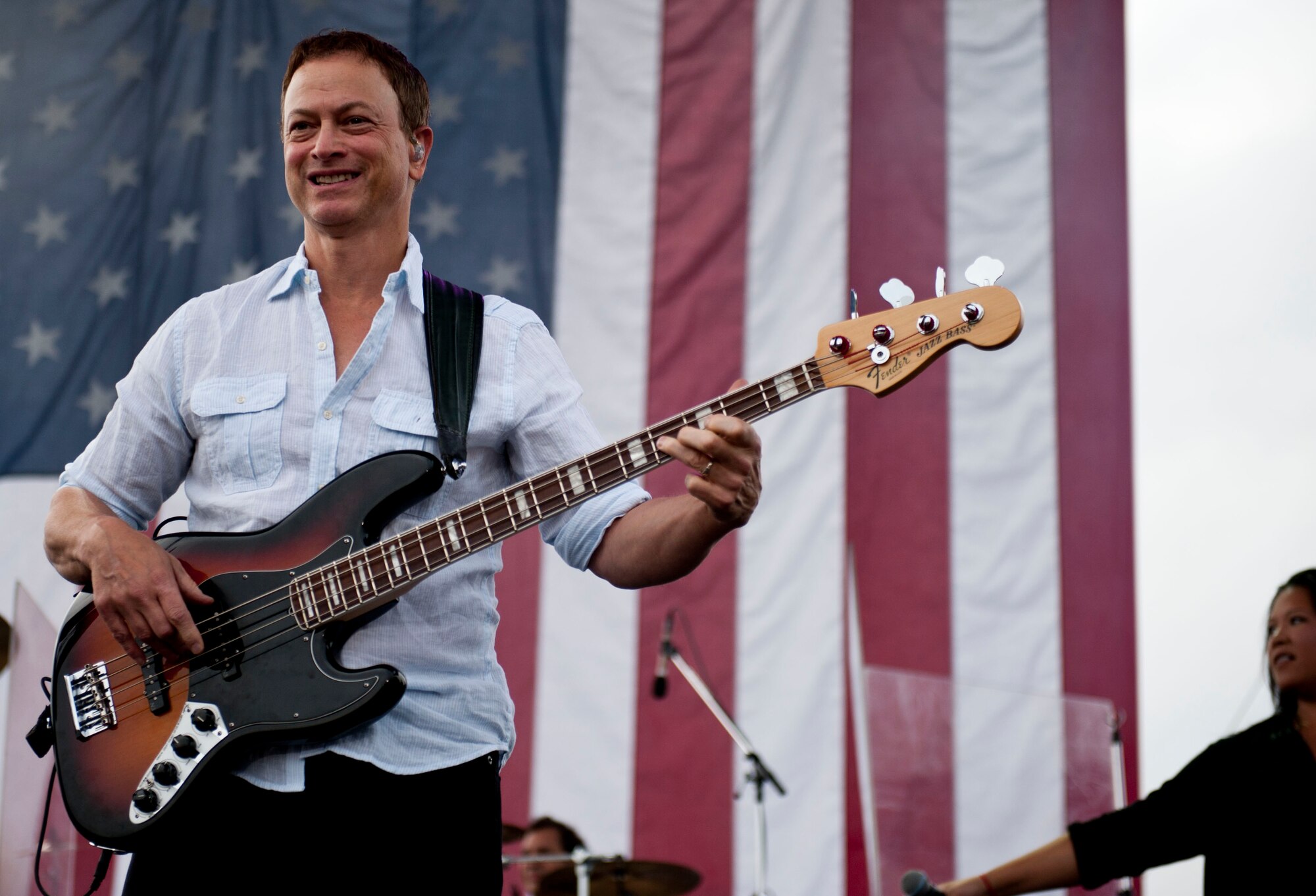 YOKOTA AIR BASE, Japan -- Actor Gary Sinise, a member of the Lt. Dan Band, plays for the audience on July 4, 2013 at Yokota Air Base, Japan.  Following the concert a fireworks display ended the annual Celebrate America day hosted by the installation. (U.S. Air Force photo by Airman First Class Meagan Schutter)