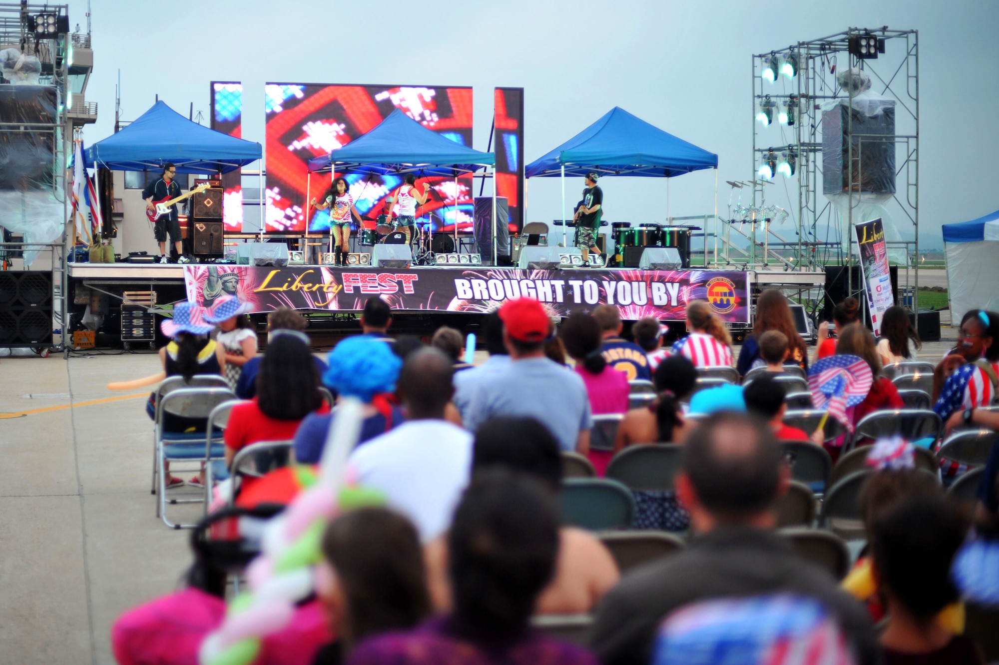 Engine Band performs live during Liberty Fest at Osan Air Base, Republic of Korea, July 4, 2013.  The six-hour event on the base operations ramp featured a multitude of entertainment and fireworks provided by 51st Force Support Squadron. (U.S. Air Force photo/Staff Sgt. Emerson Nuñez)