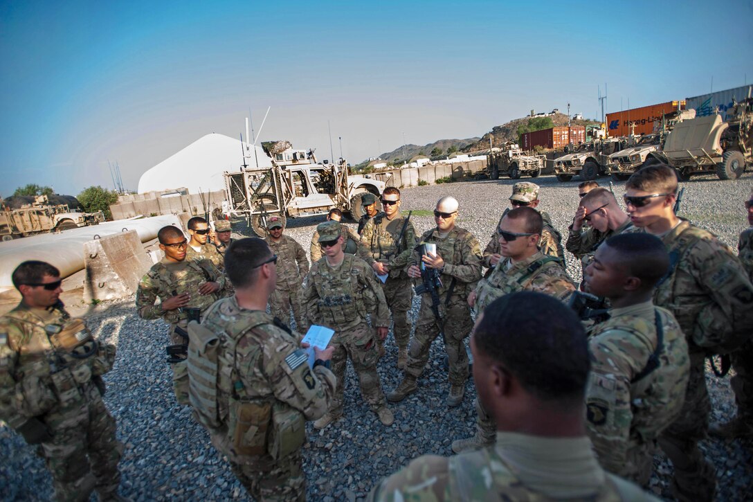 U.S. soldiers conduct a mission brief before departing Forward Operating Base Salerno in Khowst province, Afghanistan, July 4, 2013. The soldiers are assigned to 101st Airborne Division's 2nd Battalion, 506th Infantry Regiment, 4th Brigade Combat Team.