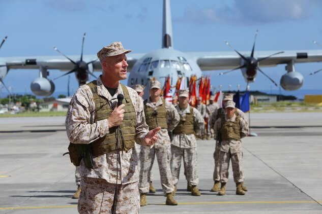 Maj. Gen. Christopher S. Owens addresses the audience during the 1st Marine Aircraft Wing change of command ceremony July 9 at Marine Corps Air Station Futenma. Owens served as the 68th commanding general of 1st MAW, III Marine Expeditionary Force, from June 2012 until July 2013. He thanked the Marines and sailors of the wing for making his term a success, and welcomed Brig. Gen. Steven R. Rudder as the new commanding general of 1st MAW. (U.S. Marine Corps photo by Lance Cpl. Natalie M. Rostran/Released)