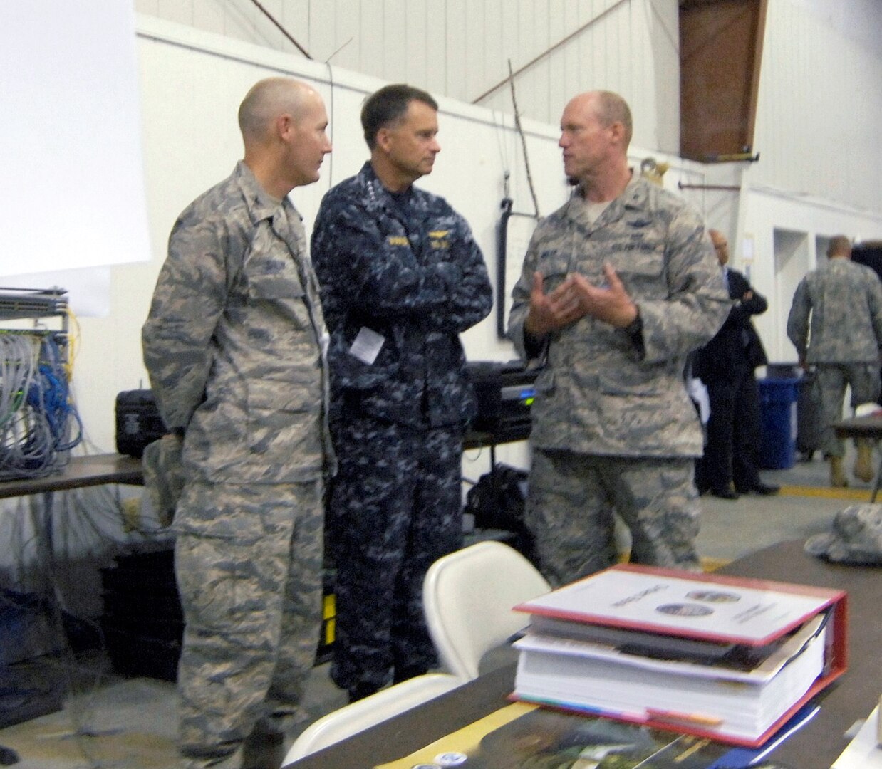 Air Force Col. Vic Dallin, the Joint Multi-Agency Operations Coordination Center operations center director, Navy Adm. James Winnefeld, U.S. Northern Command commander, and Air Force Brig. Gen. Robert Nolan, Joint Task Force – National Scout Jamboree commander, discuss Jamboree operations in the JMAOCC at the Boy Scouts of America’s 2010 National Scout Jamboree July 28. Admiral Winnefeld called USNORTHCOM’s support of the Jamboree “a tremendous honor and privilege,” committing the dedication of the Joint Task Force to ensuring a safe and fun event. 

