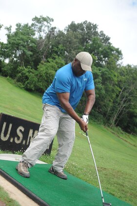 Retired Gunnery Sgt. Vic Evans, from Stafford, practices his swing at the driving range on the Medal of Honor Golf Course aboard Marine Corps Base Quantico on July 3, 2013. Free tokens can be redeemed for 55 driving range golf balls from 11 a.m. to 1 p.m. every Wednesday.