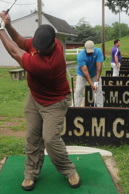 Golfers practicing their swing at the Medal of Honor Golf course aboard Marine Corps Base Quantico, Va. on July 3, 2013.  Active duty military members will get free driving range tokens every Wednesday from 11 a.m. to 1 p.m.
