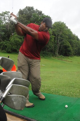 Retired Master Gunnery Sgt. Gerard Downs, from Fredericksburg, practices his swing at the driving range at the Medal of Honor Golf course aboard Marine Corps Base Quantico on July 3, 2013. Active duty military members receive free driving range tokens every Wednesday, from 11 a.m. to 1 p.m.