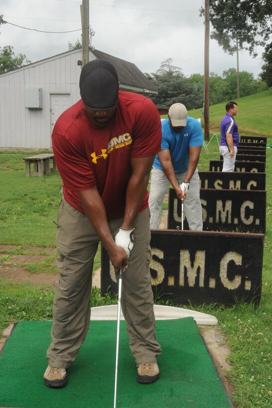 Golfers practicing their swing at the Medal of Honor Golf course aboard Marine Corps Base Quantico, Va. on July 3, 2013.  Active duty military members will get free driving range tokens every Wednesday from 11 a.m. to 1 p.m.