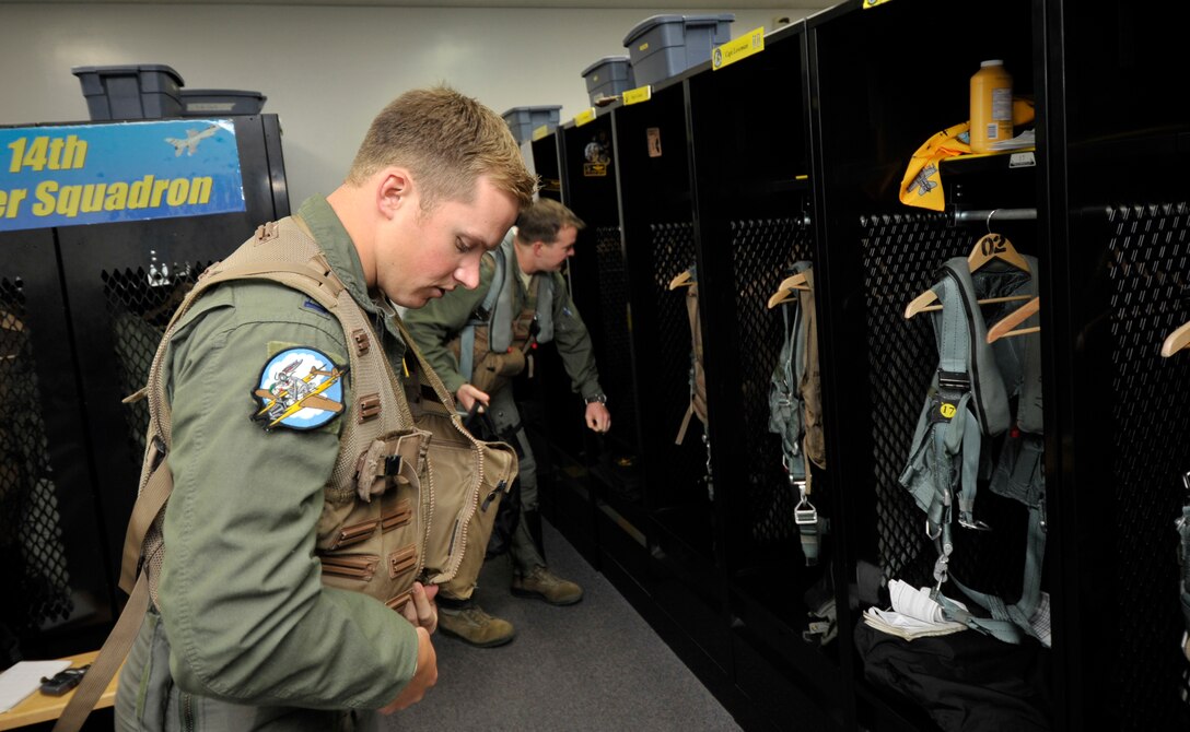 U.S. Air Force Capt. Matthew Kimmel, 14th Fighter Squadron pilot, suits up for a turkey shoot at Misawa Air Base, Japan, June 28, 2013. Kimmel and other pilots from the base flew their F-16 Fighting Falcons to Draughon Range to see who was the most accurate when attacking a ground target. (U.S. Air Force photo by Staff Sgt. Nathan Lipscomb)