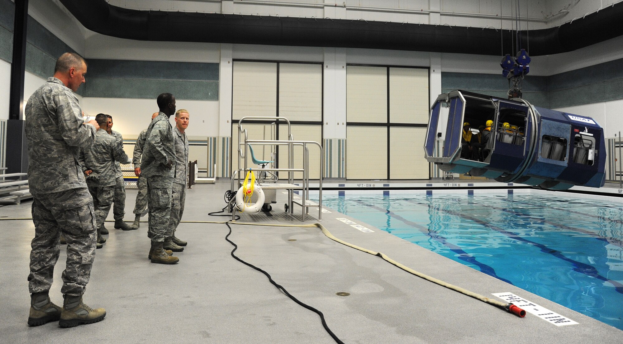 Gen. Edward Rice, commander of the Air Education and Training Command, observes a Survival, Evasion, Resistance, and Escape exercise at the water training facility at Fairchild Monday, July 1, 2013.  The general was at Fairchild to tour the operations of the 336th Training Group.  (U.S. Air Force photo by Airman 1st Class Sam Fogleman/Released)