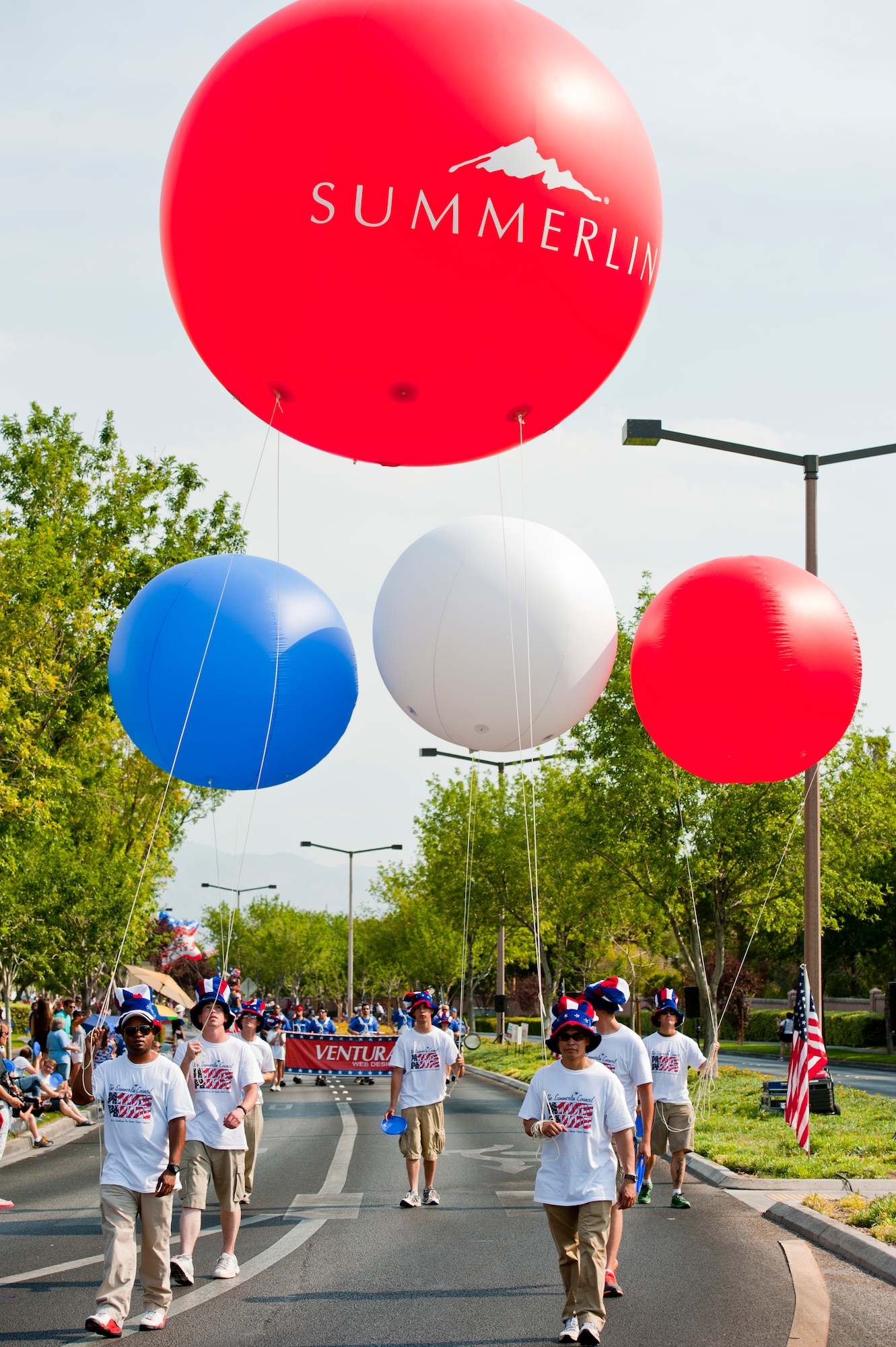 Volunteers from the Summerlin community hold patriotic balloons during the 19th Annual Summerlin Council Independence Day Parade July 4, 2013, in Las Vegas. The parade is the largest Independence Day parade in southern Nevada. (U.S. Air Force photo by Staff Sgt. Michael Charles)