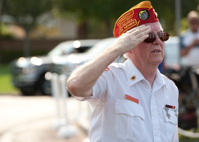 Paul Bowen, retired Marine and member of the Marine Veterans of Foreign Wars, salutes July 4, 2013, during the colors presentation at the 19th Annual Summerlin Council Independence Day Parade in Las Vegas. The event was one of many in the local area celebrating Independence Day. (U.S. Air Force photo by Staff Sgt. Michael Charles)