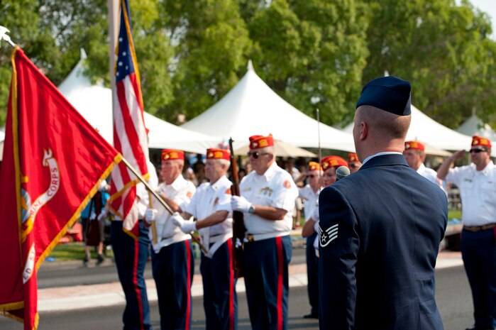 Staff Sgt. Benjamin Ekblad, 99th Civil Engineer Squadron structural journeyman, sings the national anthem while members of the Marine Veterans of Foreign Wars present the colors July 4, 2013, during the 19th Annual Summerlin Council Independence Day Parade in Las Vegas. Airmen from Nellis Air Force Base volunteered to be part of the parade in order to celebrate America’s armed forces and their contribution to the birth the nation. (U.S. Air Force photo by Staff Sgt. Michael Charles)