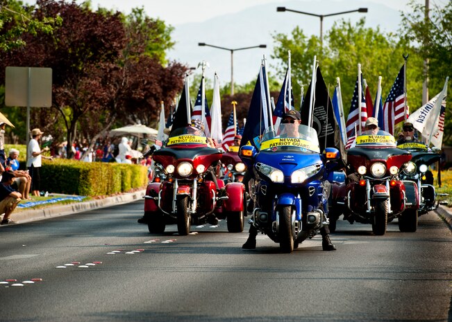 Members of the Nevada Patriot Guard participate in the 19th Annual Summerlin Council Independence Day Parade July 4, 2013, in Las Vegas. The Nevada Patriot Guard is an organization of motorcycle enthusiasts who honor fallen service members and their families during funeral services. More than 30,000 people turned out to enjoy the parade, which takes place to honor the local community, military members and celebrate the birthday of the nation. (U.S. Air Force photo by Staff Sgt. Michael Charles)