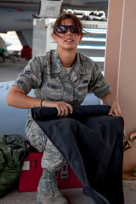 Airman 1st Class Jami DeVries wraps up a seat cover during maintenance procedures on the F-16 Fighting Falcon as part of the exercises taking place during Eager Lion. Eager Lion is a U.S. Central Command-directed, irregular warfare-themed exercise focusing on missions the United Dates and its coalition partners might perform in support of global contingency operations. (U.S. Air National Guard photo by Senior Master Sgt. John P. Rohrer)