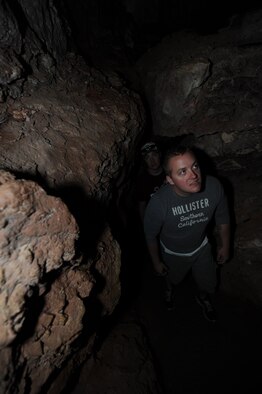 Airman 1st Class Theodore Zielinski, 28th Aircraft Maintenance Squadron defensive avionics technician, explores the inside of Wind Cave while at Wind Cave National Park in Hot Springs, S.D., July 2, 2013. Zielinski, alongside three of his fellow Airmen, learned about the history of the park through various exhibits and informational booths, before exploring the depths of the cave during the Fairgrounds Cave Tour. (U.S. Air Force photo by Airman 1st Class Hrair H. Palyan/Released)
