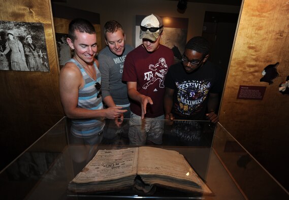 Four Airmen from the 28th Aircraft Maintenance Squadron learn about the history of Wind Cave National Park at the park’s visitor center in Hot Springs, S.D., July 2, 2013. In addition to cave tours, WCNP boasts a number of nature trails, picnic areas and indoor exhibits that feature much of the wildlife that live near Wind Cave. (U.S. Air Force photo by Airman 1st Class Hrair H. Palyan/Released)