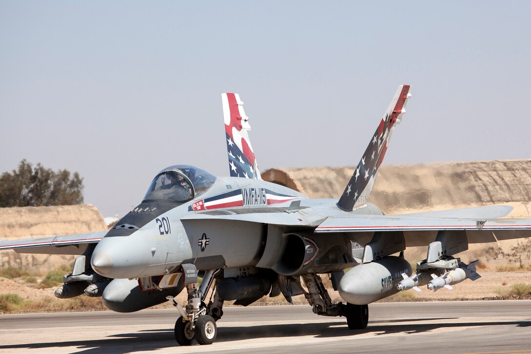 A Marine F-18 Hornet taxis into position for takeoff at a training base in Northern Jordan as part of Exercise Eager Lion. The Marine jets will play “aggressors” during air-to-air maneuvers that take place here as part of the ongoing training performed between the Americans and Jordanians. Eager Lion is a U.S. Central Command-directed, irregular warfare-themed exercise focusing on missions the United States and its coalition partners might perform in support of global contingency operations. (U.S. Air National Guard photo by Senior Master Sgt. John P. Rohrer)