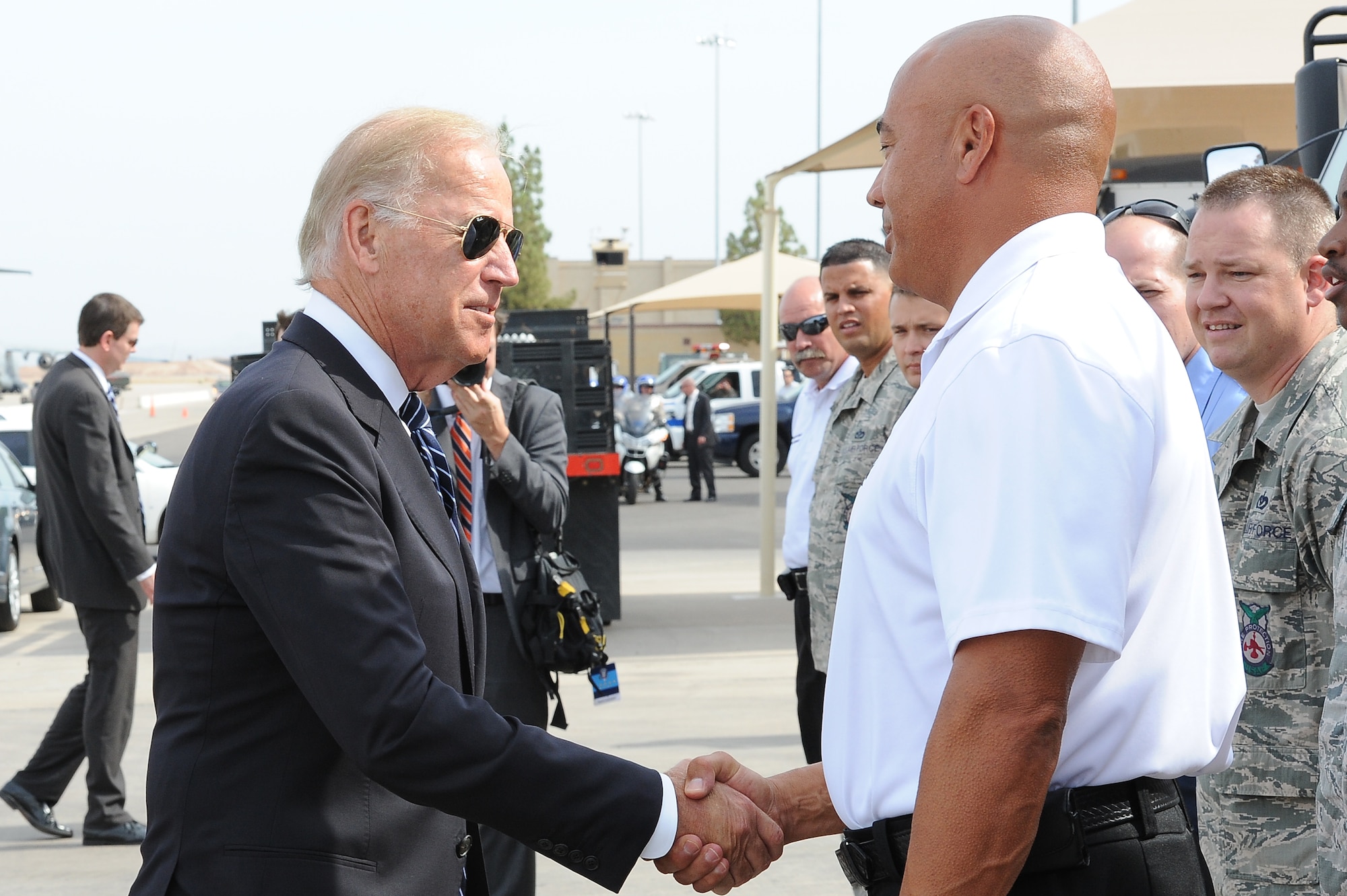 Vice President Joe Biden shakes hands with Tony Robonza, 56th Civil Engineer Squadron deputy fire chief, Tuesday at Luke Air Force Base. Biden visited Luke AFB while en route to the memorial service held for the 19 firefighters who gave their lives while fighting the Yarnell Hill fire. (U.S. Air Force photo/Airman 1st Class James Hensley)