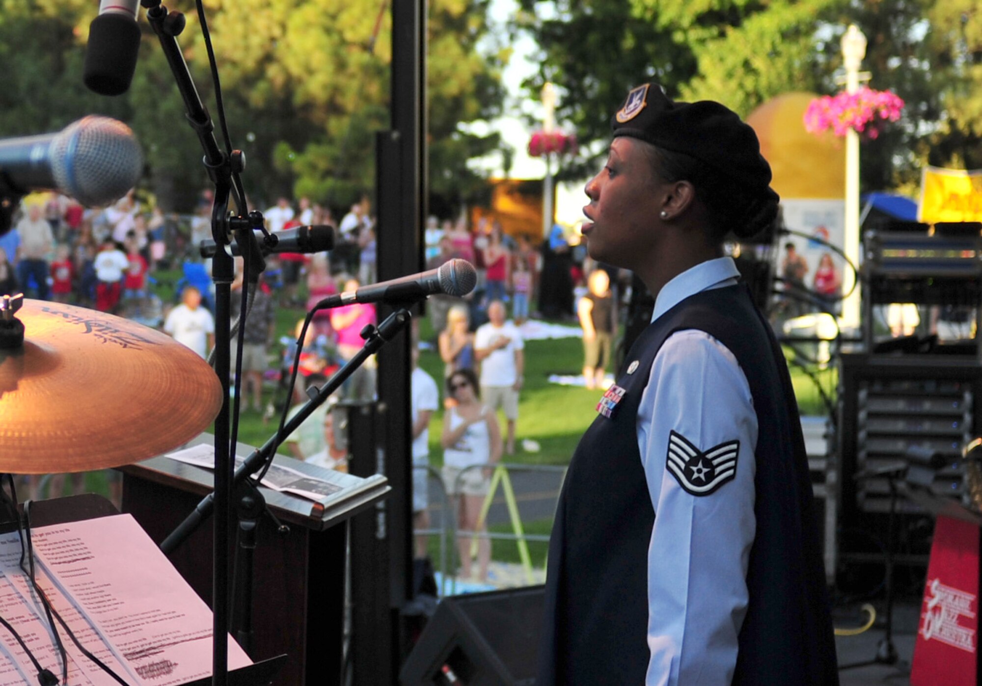 Staff Sgt. Denine Deal, 92nd Security Forces Squadron police services, sings the National Anthem during the welcoming ceremony at the 4th of July Celebration in downtown Spokane, Wash. (U.S. Air Force photo by Senior Airman Taylor Curry)