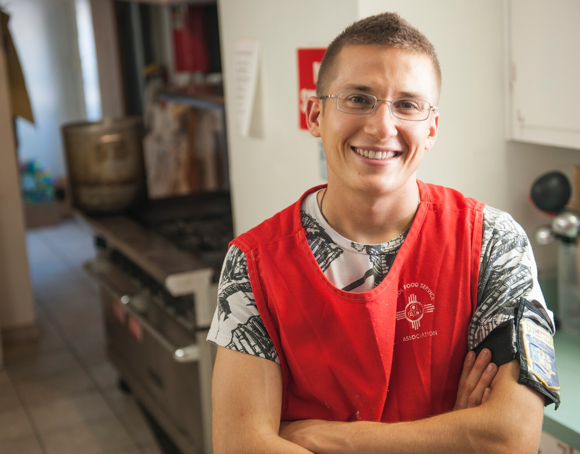 Kyle Schriever, 49th Logistic Readiness Squadron material maintenance specialist, poses inside a soup kitchen at St. John’s Episcopal Church, Alamogordo, N.M., July, 8. Schriever coordinated resources and volunteers every third Thursday of the month to service the community by distributing free meals. (U.S. Air Force photo by Airman 1st Class Daniel E. Liddicoet/Released)