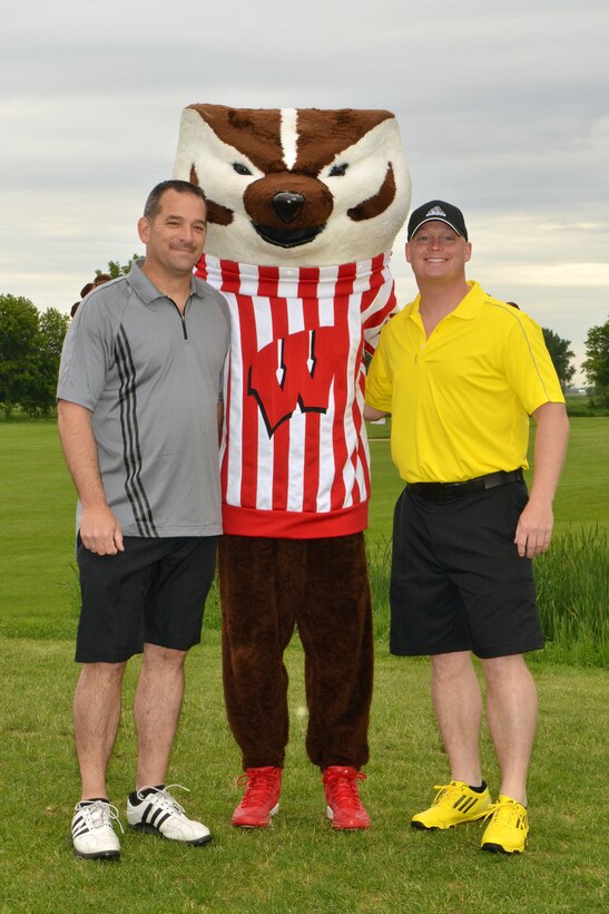 115th Fighter Wing members Darin Trautner, left, and Brandon Lutz, take a moment to pose with University of Wisconsin mascot Bucky Badger prior to the start of the 2013 Falcon Open charity golf tournament at Bridges Golf Course in Madison, Wis. June 7. Proceeds from the event raised over $7000 to assist local Air National Guard Airmen and their families in times of need.