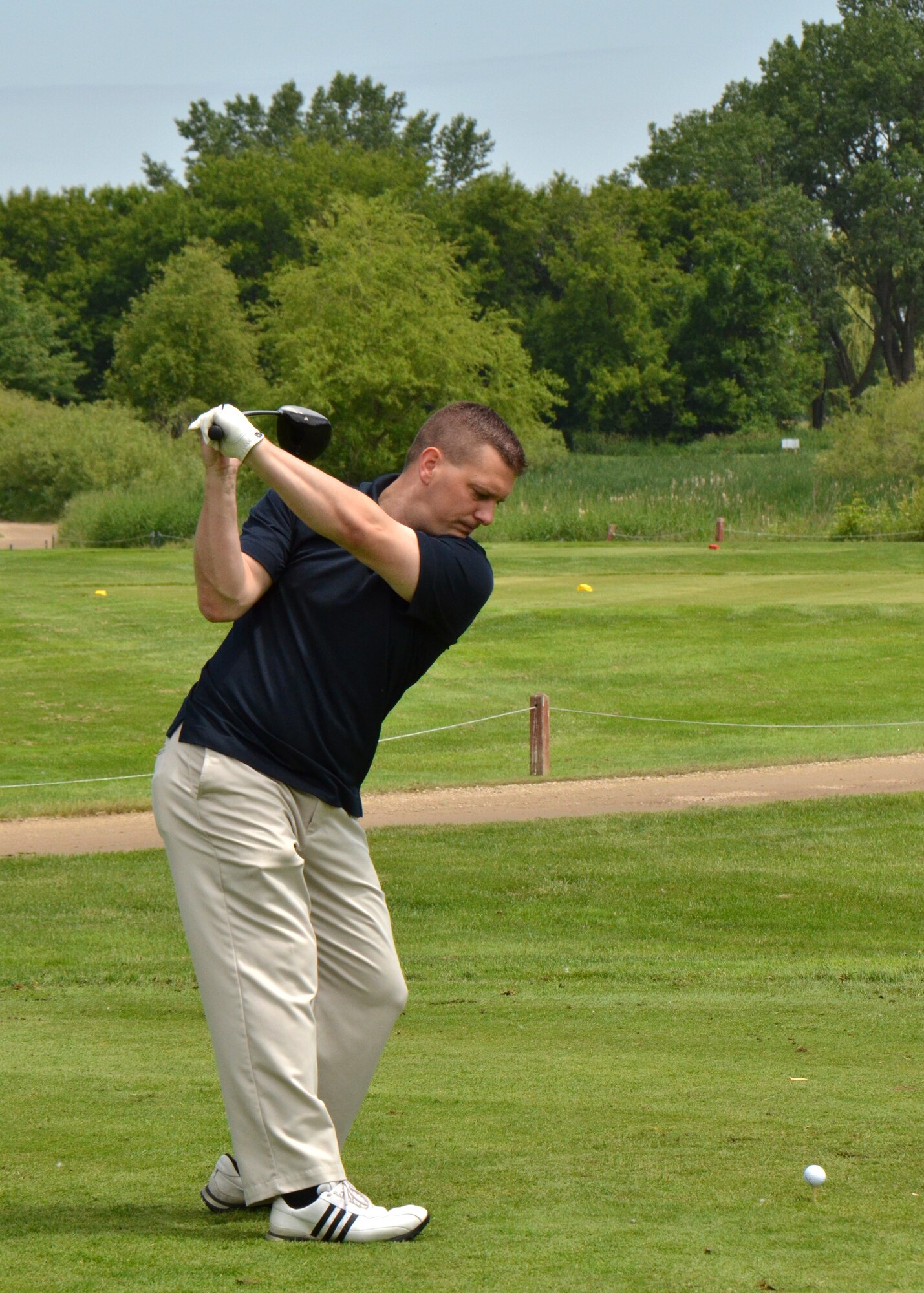 115th Fighter Wing budget analyst Joshua Johnson tees off for the 2013 Falcon Open charity golf tournament at Bridges Golf Course in Madison, Wis. June 7. Proceeds from the event raised over $7000 to assist local Air National Guard Airmen and their families in times of need.