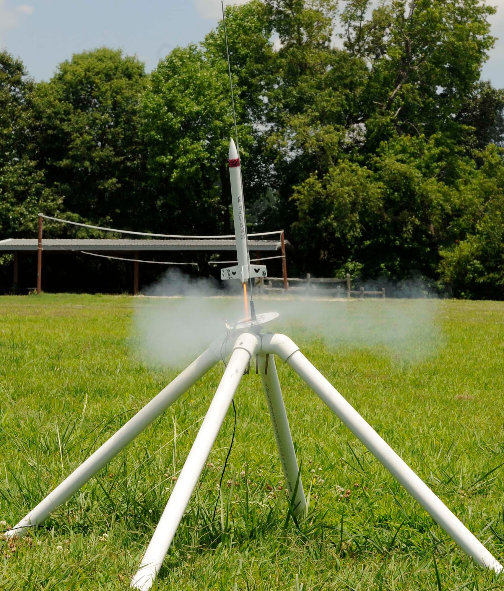 A model rocket prepares to launch during the Langley summer youth program Science, Technology, Engineering and Math Dream Team Camp at Bethel Park in Hampton Va., June 28, 2013. The weeklong camp is one of the many programs offered to children through summer youth programs at Joint Base Langley Eustis, Va. (U.S. Air Force photo by Staff Sgt. Dana Hill/Released)