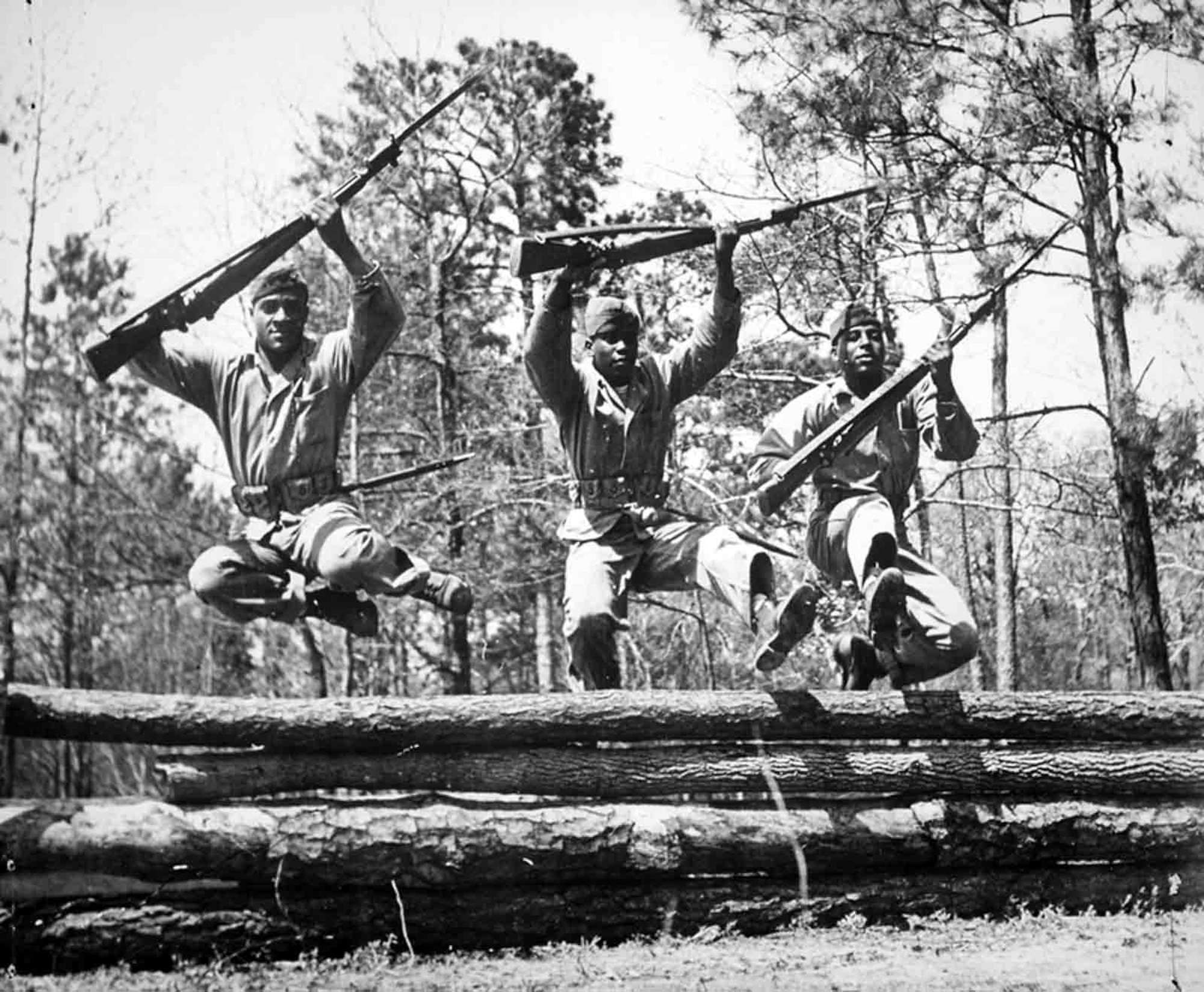 U.S. Marines jump over an obstacle during basic training at Camp Montford Point, N.C. The Marines who visited Langley Air Force Base, Va., July 2, 2013, trained under well-known drill instructors like Sgt. Majs. Gilbert “Hashmark” Johnson and Edgar Huff, and provide a unique insight into a pivotal moment in military history. (Courtesy photo/Released)