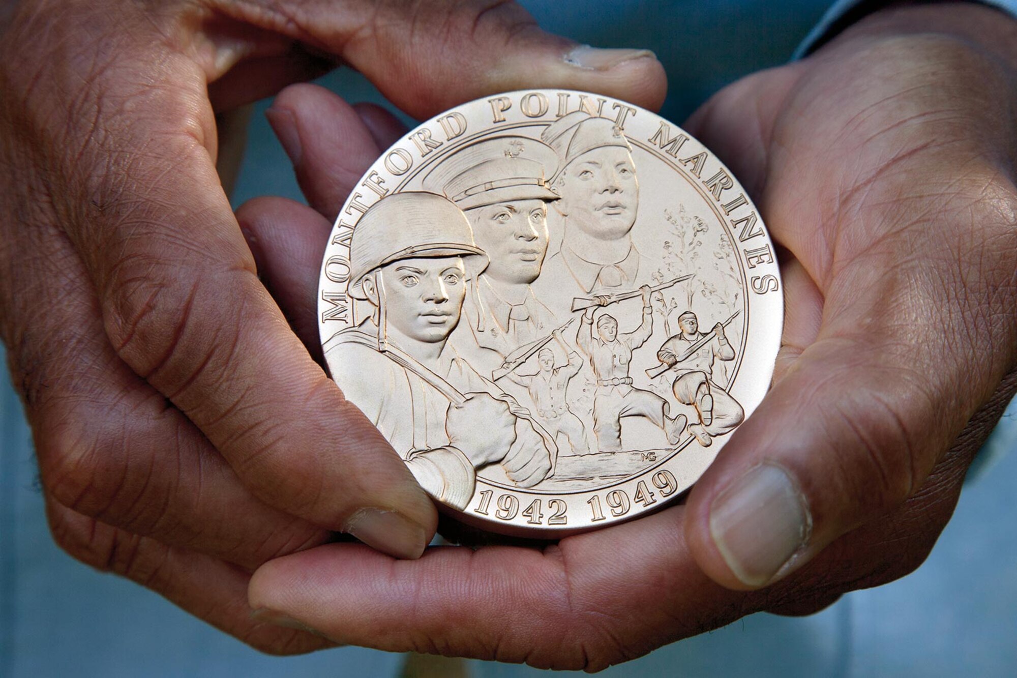 A Montford Point U.S. Marine holds his Congressional Gold Medal after the award ceremony in Washington, D.C., June 27, 2012. After President Barack Obama signed the legislation into law, the Marines received the highest civilian honor for their contributions to American history. (Courtesy photo/Released)