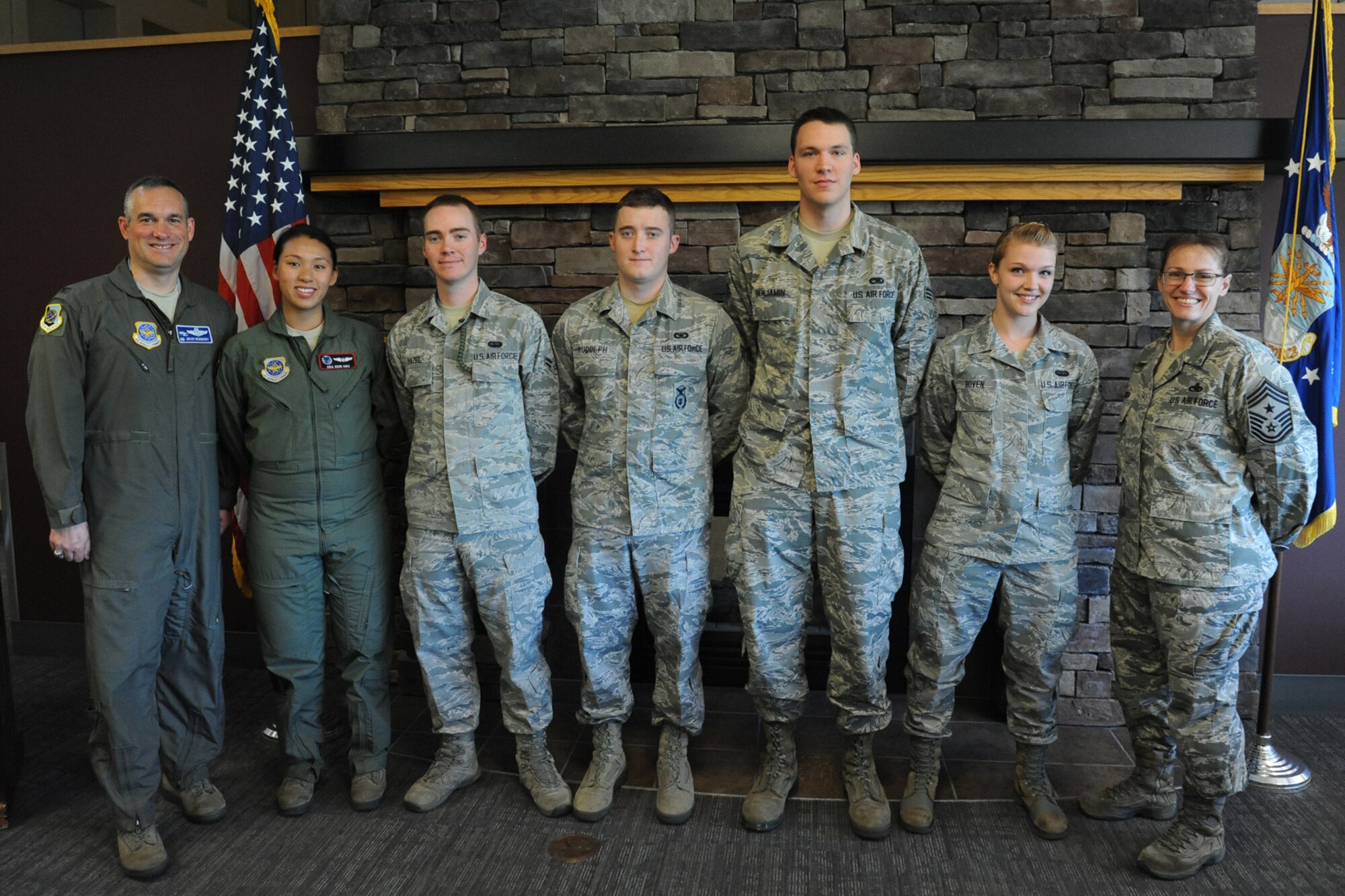 Col. Brian Newberry, 92 Air Refueling Wing commander, and Chief Master Sgt. Wendy Hansen, 92 Air Refueling Wing command chief, recognized Senior Airman Erin Ong, A1C Alexander Hazel, Senior Airman Robert Rudolph, Senior Airman Steven Benjamin, and A1C Chloe Boven during the Diamond Sharp award ceremony at Fairchild Air Force Base, Wash., July 9, 2013. The Diamond Sharp Award is an honor that goes to whom the first sergeants believes to be the most outstanding Airmen, starting from doing great things at their work place, volunteering into the community, and always displaying excellence in all they do whenever and wherever they are. (U.S. Air Force photo by Senior Airman Samantha Krolikowski/ Released)