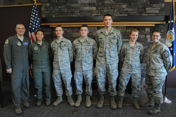 Col. Brian Newberry, 92 Air Refueling Wing commander, and Chief Master Sgt. Wendy Hansen, 92 Air Refueling Wing command chief, recognized Senior Airman Erin Ong, A1C Alexander Hazel, Senior Airman Robert Rudolph, Senior Airman Steven Benjamin, and A1C Chloe Boven during the Diamond Sharp award ceremony at Fairchild Air Force Base, Wash., July 9, 2013. The Diamond Sharp Award is an honor that goes to whom the first sergeants believes to be the most outstanding Airmen, starting from doing great things at their work place, volunteering into the community, and always displaying excellence in all they do whenever and wherever they are. (U.S. Air Force photo by Senior Airman Samantha Krolikowski/ Released)