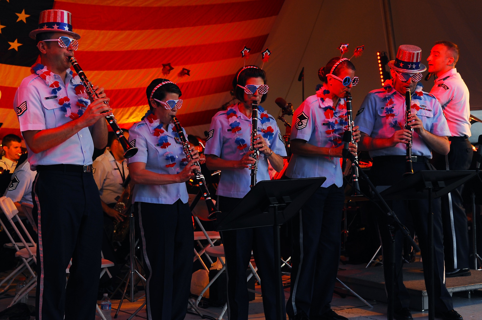 The U.S. Air Force Heritage of America Band plays patriotic music for the "4th of July Stars in the Sky” event held at Victory Landing Park in Newport News, Va., July 4, 2013. The band, established in 1941, features the diverse talents of 38 professional musicians who tour across the country year round. (U.S. Air Force photo by Airman 1st Class Victoria H. Taylor/Released)