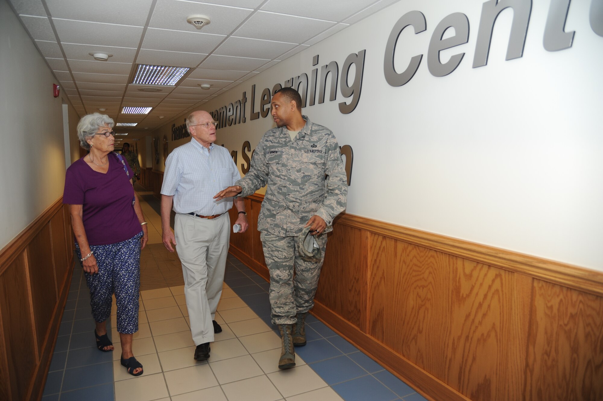 Jane and Paul Heintz receive a tour of Allee Hall from Master Sgt. LeQuary Farmer, 335th Training Squadron, following a windshield tour of the Base July 9, 2013, at Keesler Air Force Base, Miss.  Paul is the son of Col. Edward Allee, in which the building is named after.  Allee died in May 1944 in a plane crash during a training mission.  (U.S. Air Force photo by Kemberly Groue)