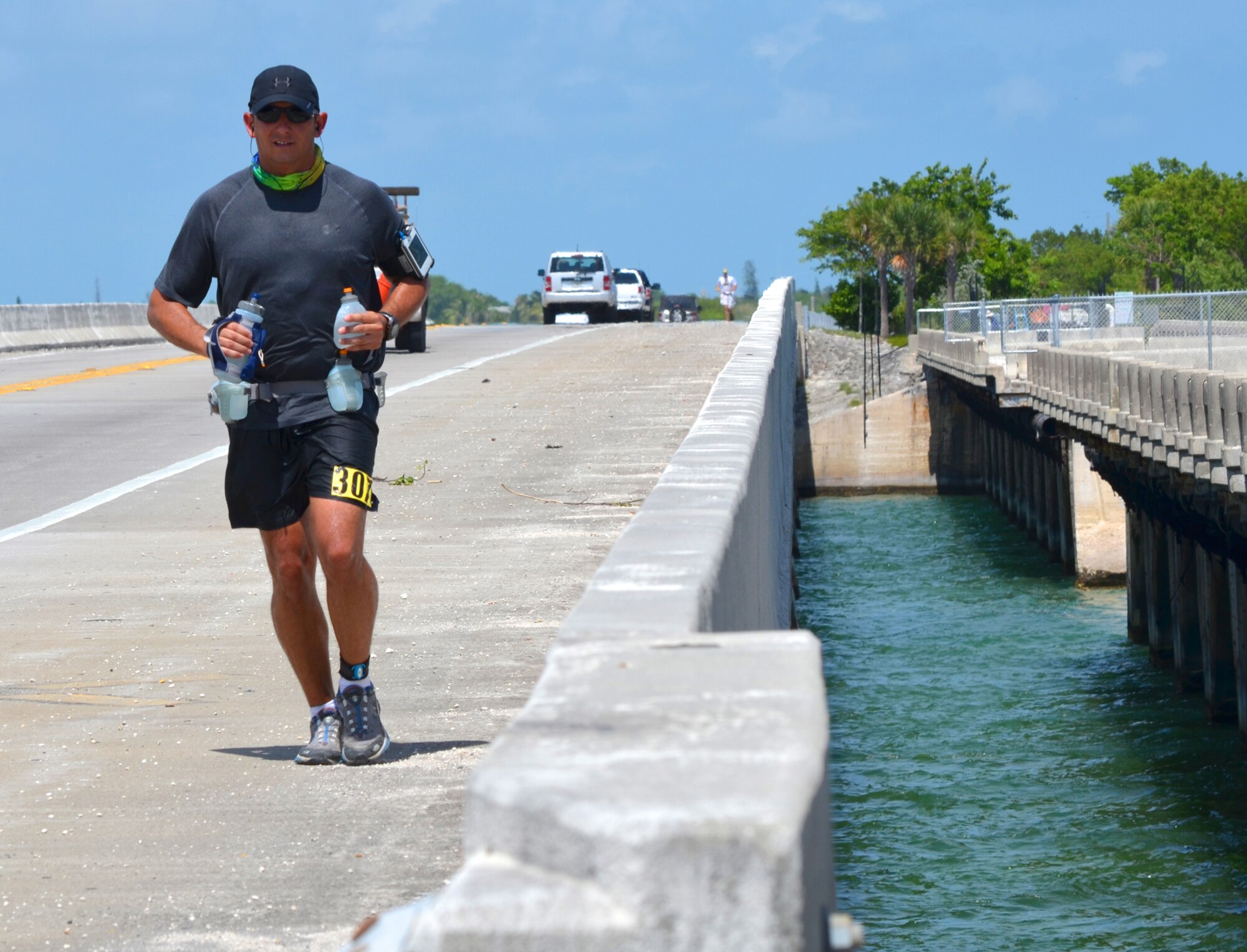 Combat-search-and-rescue pilot Capt. Jason Tomas, 920th Rescue Wing, Patrick Air Force Base, Fla., finished his first 50-mile ultra-marathon journey in 14.42 hours. It began at mile marker 50 on Marathon Key and ended at Higgs Beach near the southernmost point in the continental U.S., Key West. He added 4.5 hours to his total finish time because he took frequent breaks to beat the heat. He thanks his personal first-aid crew, wife Kaili and 11-year-old daughter Alani, for providing him ice to help him get his body temperature down. He estimated that he burned 13,000 calories at the Keys100. (Courtesy photo Kali and Alani Tomas)
