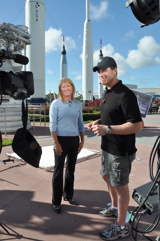 Kathy Winters, a weather officer from the 45th Weather Squadron, is interviewed by the Weather Channel at John F. Kennedy Space Center Visitor Complex, Fla., July 9, 2013. Winters discussed the mission of the squadron and what makes Patrick's weather team unique from other weather flights and squadrons within the military. (U.S. Air Force photo/Heidi Hunt) (Released)