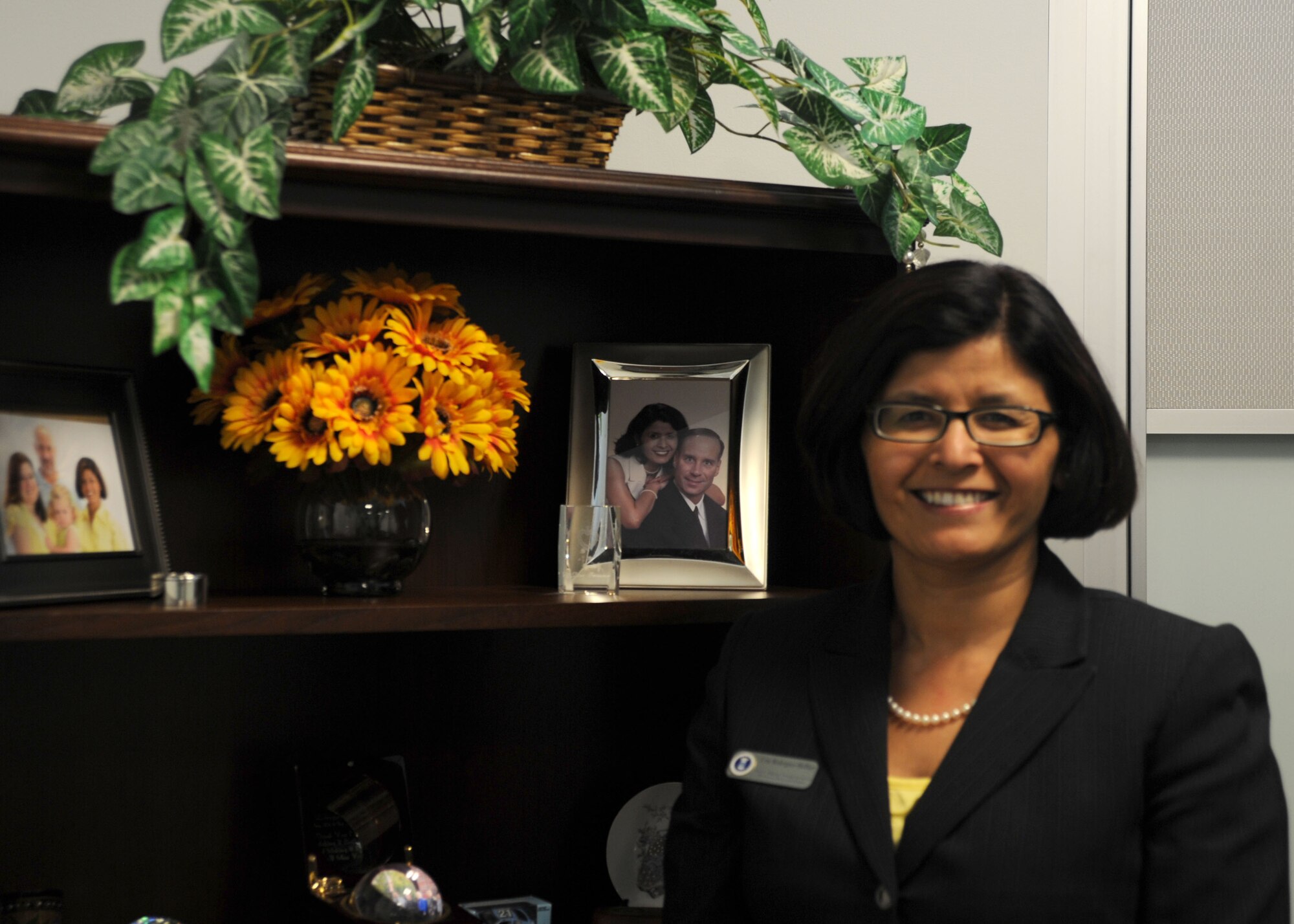 Erm Rodriguez-Heffner, AFDW Manpower, Personnel and Services director, earned the 2013 Federally Employed Women's Champion of Diversity Award. The award Rodriguez-Heffner earned recognizes the work she has done to champion diversity throughout her Air Force career. (U.S. Air Force photo by Tech. Sgt. Tammie Moore)