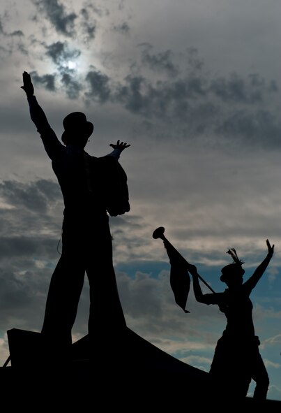 Members of the Clan Tynker performance group pose during the Freedom Fest Independence Day celebration at Holloman Air Force Base, N.M., July 3. Freedom Fest took place in the Domenici Fitness and Sports Center parking lot and included carnival games, rides, and live music for Airmen and their families. (U.S. Air Force photo illustration by Airman 1st Class Aaron Montoya/Released)