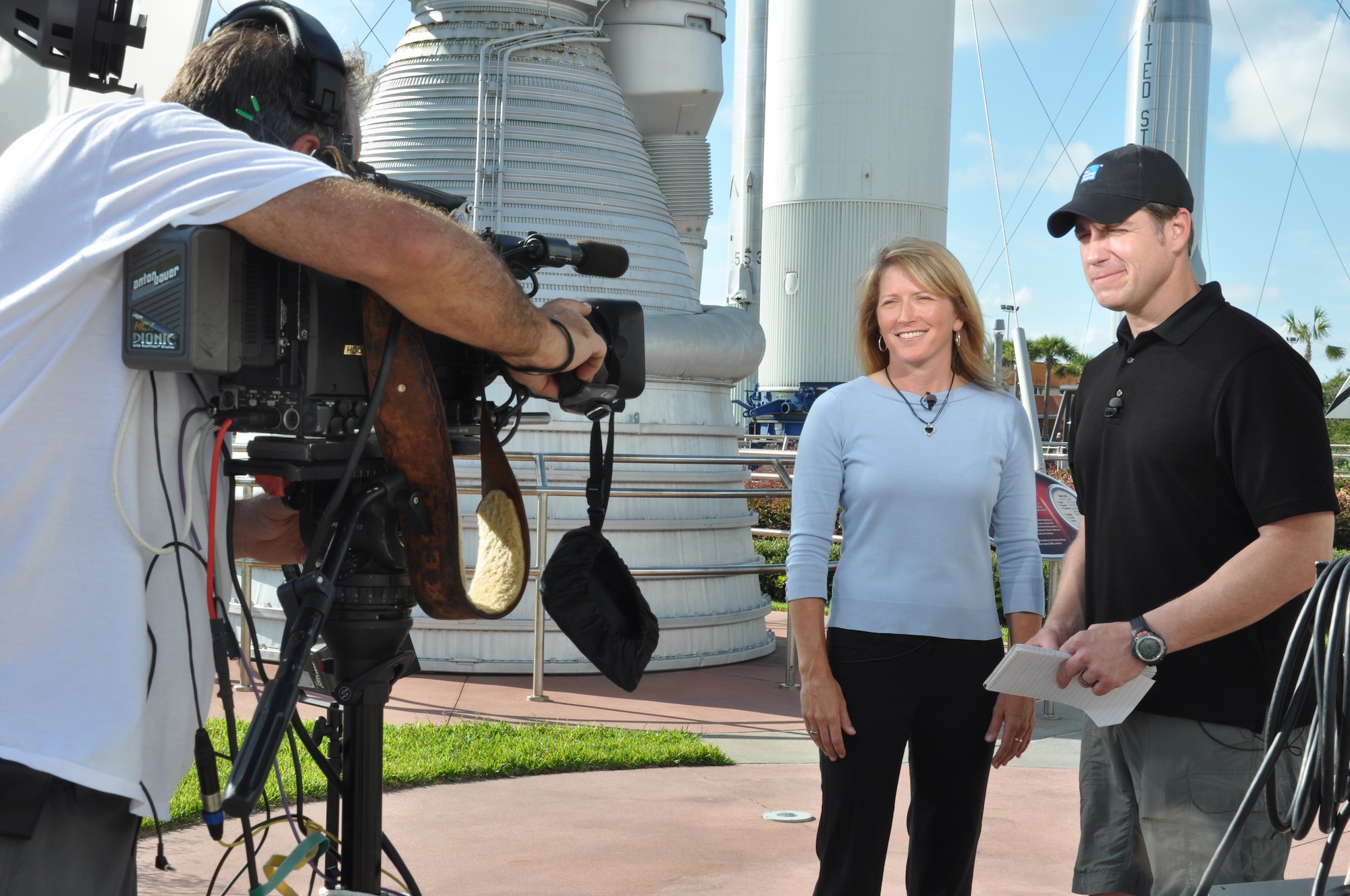 Kathy Winters, a weather officer from the 45th Weather Squadron, is interviewed by the Weather Channel at John F. Kennedy Space Center Visitor Complex, Fla., July 9, 2013. Winters discussed the mission of the squadron and what makes Patrick's weather team unique from other weather flights and squadrons within the military. (U.S. Air Force photo/Heidi Hunt) (Released)