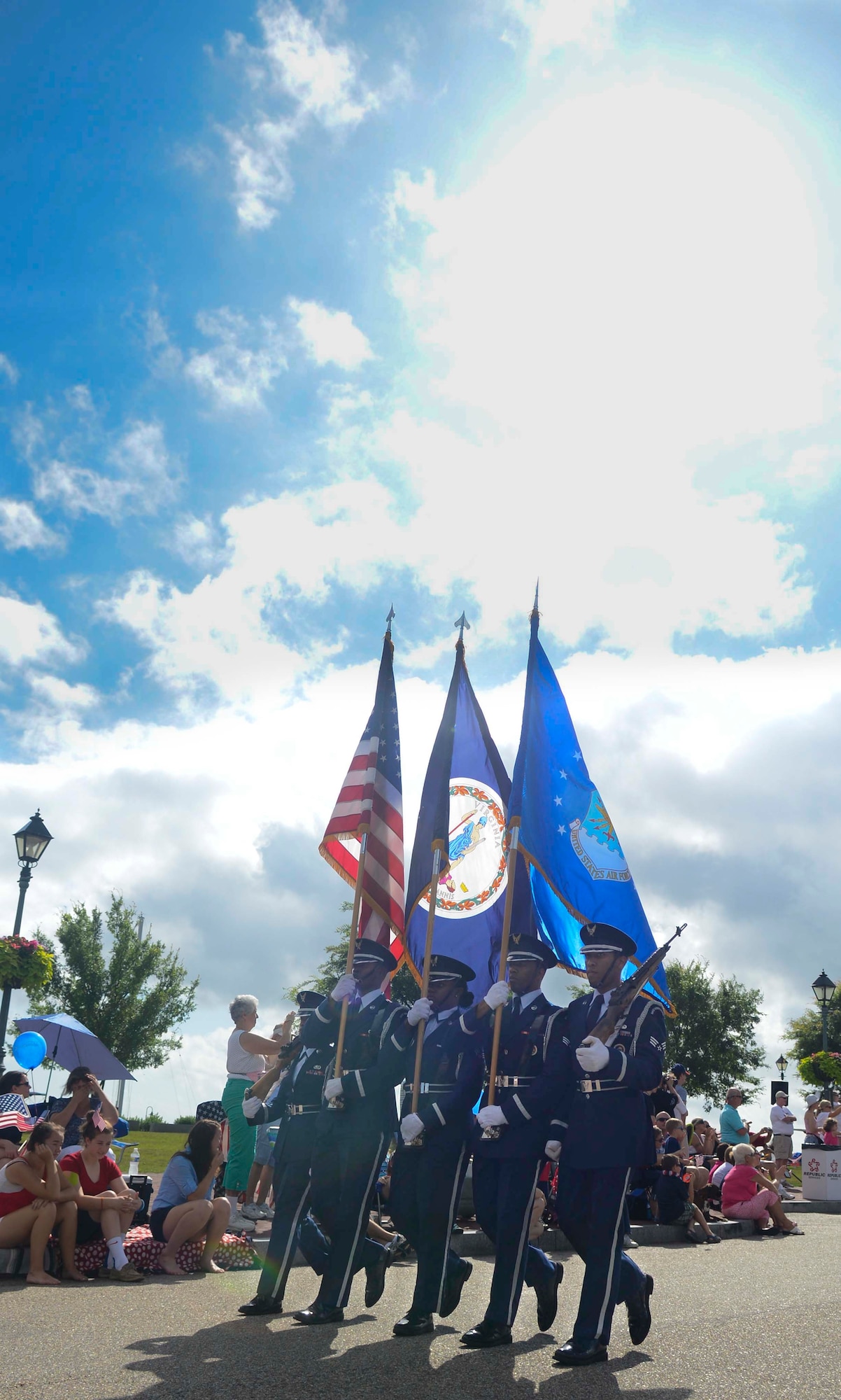 The Langley Air Force Base, Va., color guard marches through the Yorktown beachfront July 4, 2013 at Yorktown, Va. Each of the five military services were represented in the town’s annual Independence Day parade. (U.S. Air Force photo by Airman 1st Class Austin Harvill/Released)
