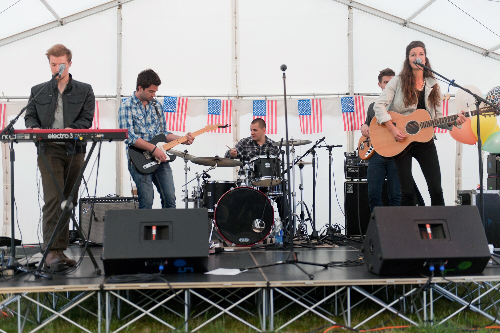 RAF ALCONBURY, United Kingdom – Armed Forces Entertainment presented a free concert by up-and-coming country music artist Nicole Frechette at RAF Alconbury July 2. Frechette also performed at RAF Croughton July 1. This is her third tour with AFE in support of the military. (U.S. Air Force photo by Staff Sgt. Brian Stives)