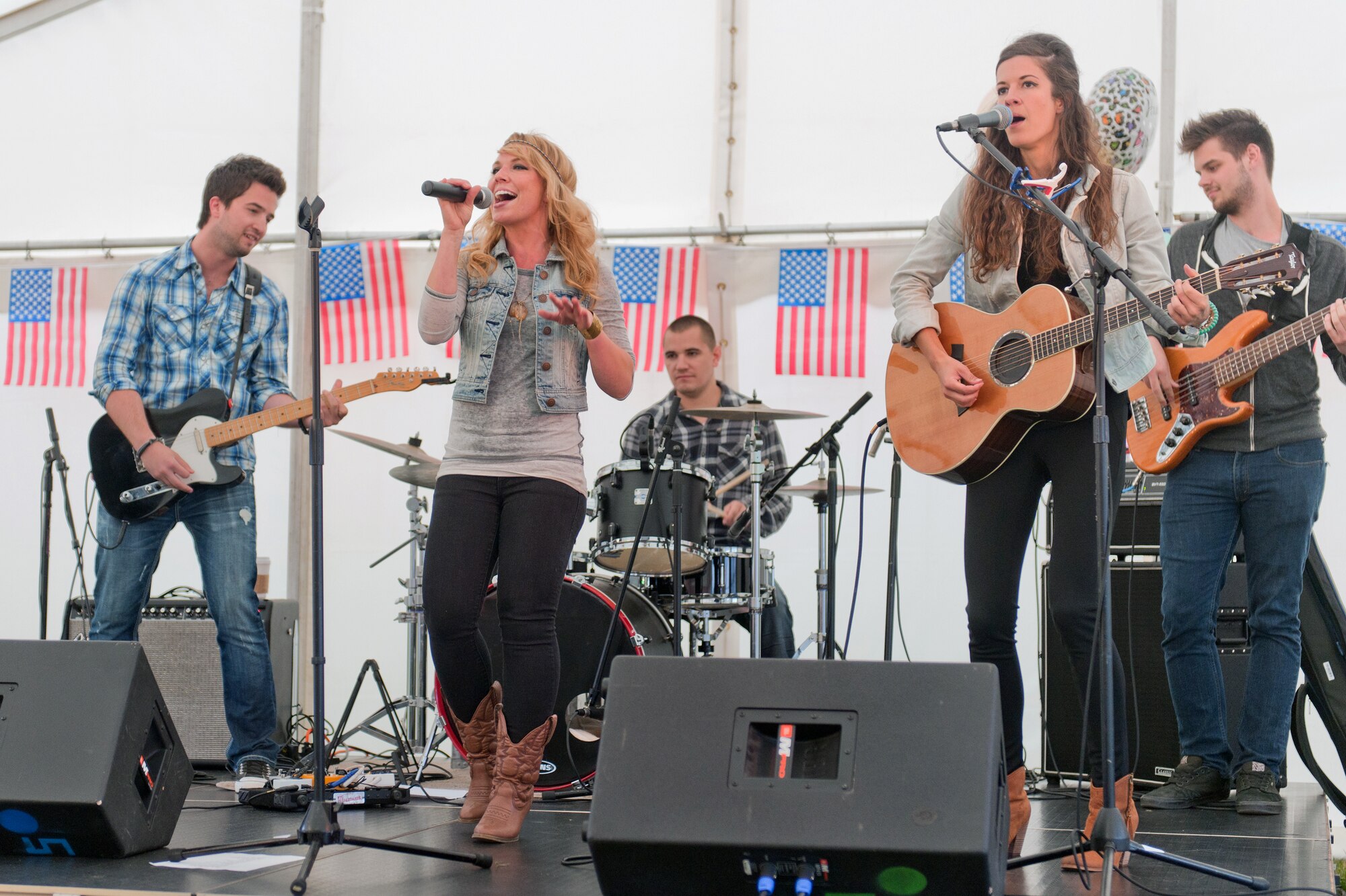 RAF ALCONBURY, United Kingdom – Armed Forces Entertainment presented a free concert by up-and-coming country music artist Nicole Frechette at RAF Alconbury July 2. Frechette also performed at RAF Croughton July 1. This is her third tour with AFE in support of the military. (U.S. Air Force photo by Staff Sgt. Brian Stives)