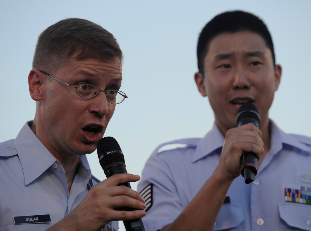 Master Sgt. Ryan Dolan and Tech. Sgt. Benjamin J. Park, The U.S. Air Force Band Singing Sergeants, perform at the 2013 Fourth of July firework show at the Air Force Memorial in Washington, D.C.  Col. William Knight, 11th Wing/Joint Base Andrews Commander gave the opening remarks. (U.S. Air Force photo/Airman 1st Class Nesha Humes)