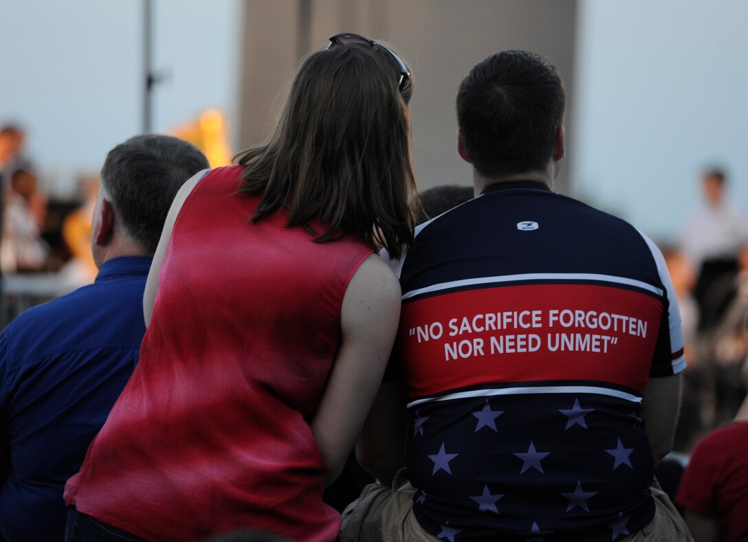 Audience members watch as The United States Air Force Band performs prior to the 2013 Fourth of July firework show at the Air Force Memorial in Washington, D.C.  The band gave tribute to all those sacrifice for our country by singing a rendition of Edward Sharpe and the Magnetic Zeros song, “Home.” (U.S. Air Force photo/Airman 1st Class Nesha Humes)